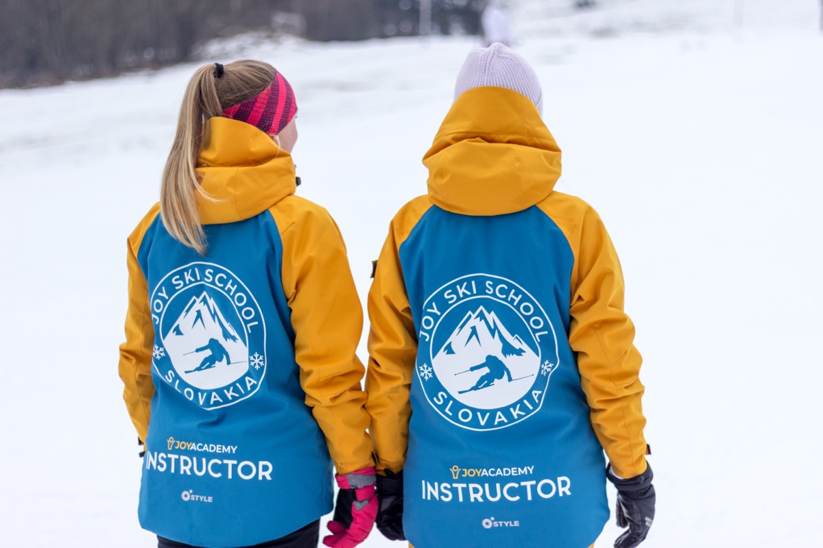 Two Joy Academy instructors seen from behind