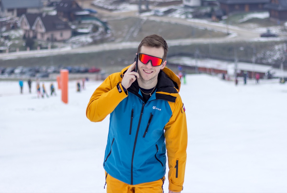 Smiling instructor on the slope near the resort
